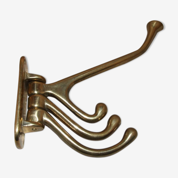 Articulated brass patère