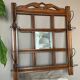 Art Deco wall-mounted coat rack in oak, early 20th century. Beveled central mirror