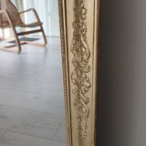 Wood and gilded stucco mirror, 19th century, 115 x 61.5 cm.