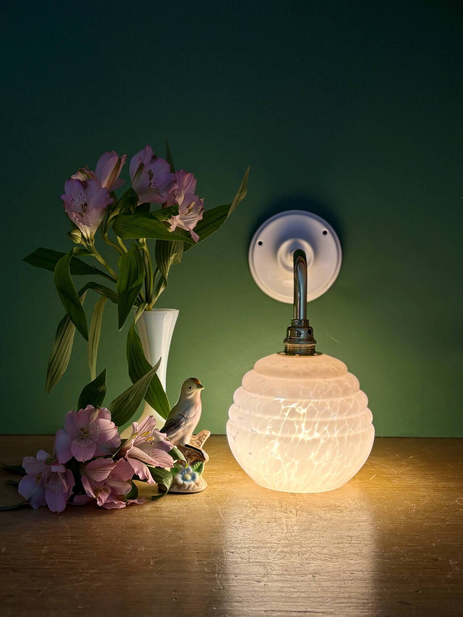 Vintage pink Clichy glass globe wall light.