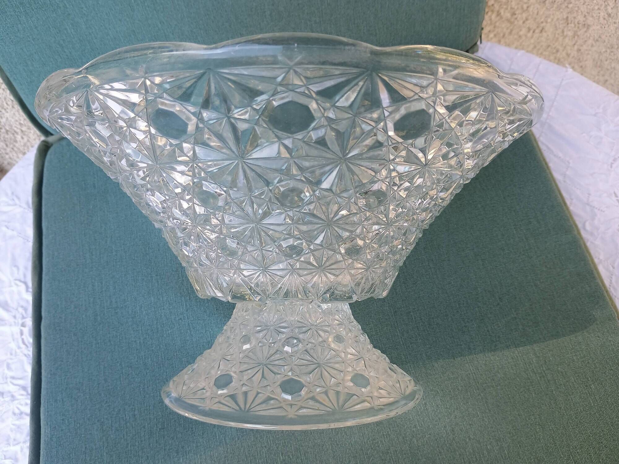 Flared fruit bowl with a pedestal, all made of pressed moulded glass, mid-20th century.