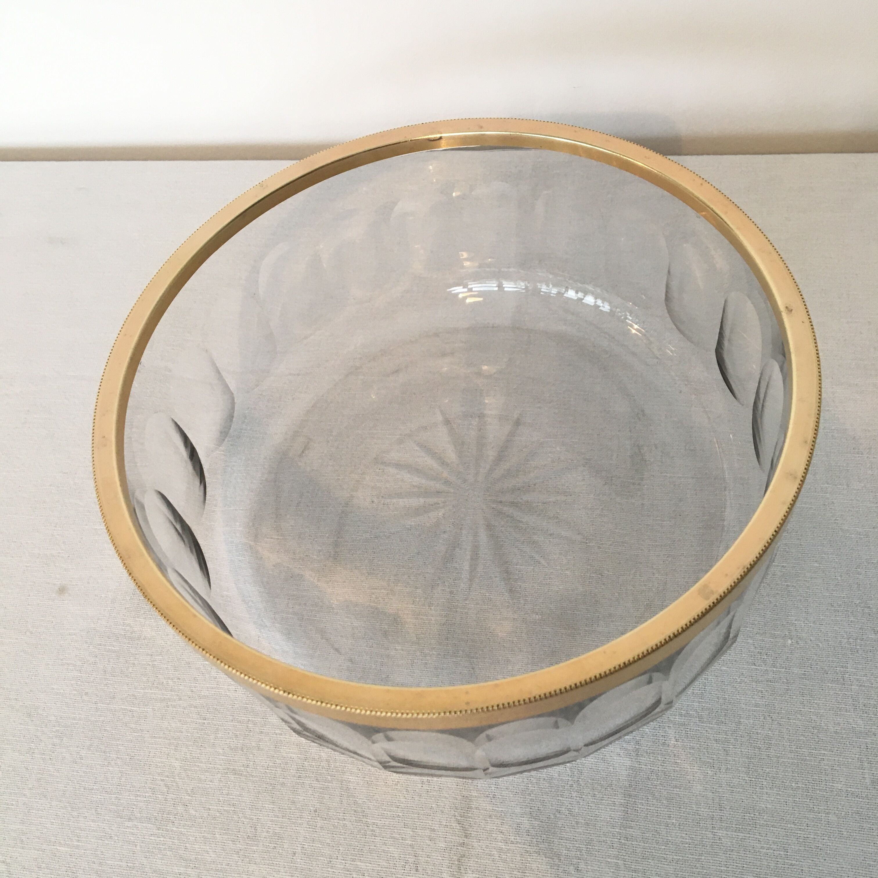 Crystal bowl trimmed surrounded gold metal