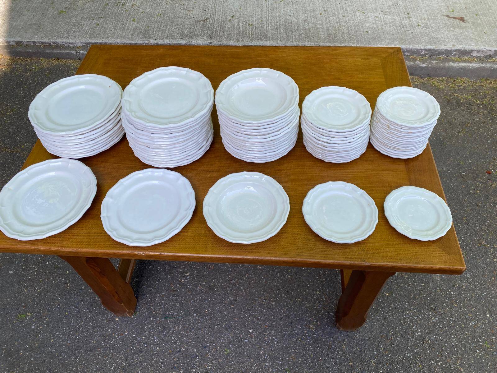 Service of 84 vintage white porcelain plates.