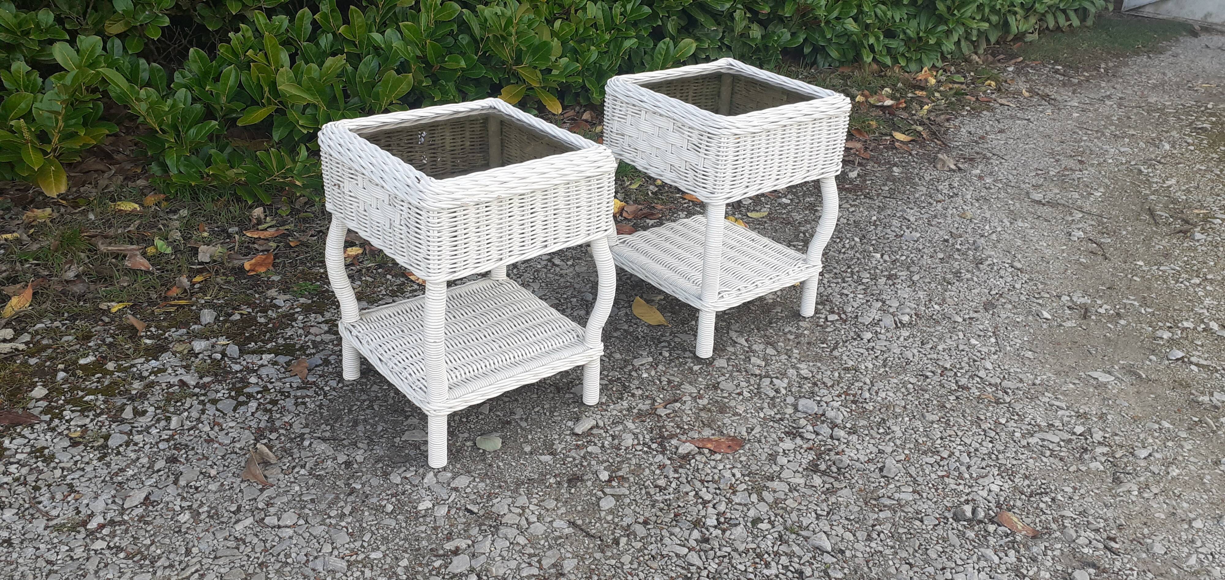 Pairs of white rattan side tables and smoked glass