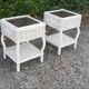 Pairs of white rattan side tables and smoked glass
