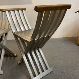 Pair of curule chairs designed by John Vesey, 1958, USA, brushed aluminum, walnut and leather