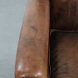 Beautiful vintage sheep leather armchair with a characterful appearance