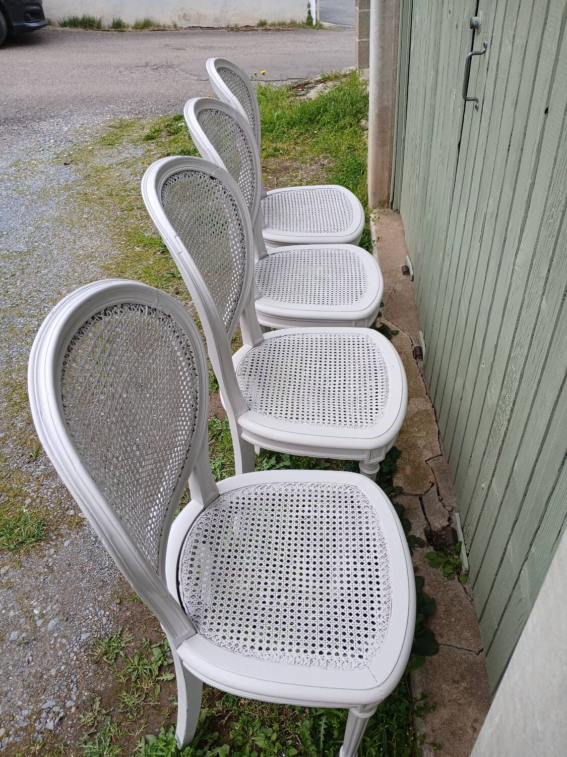 4 old wooden and cane chairs