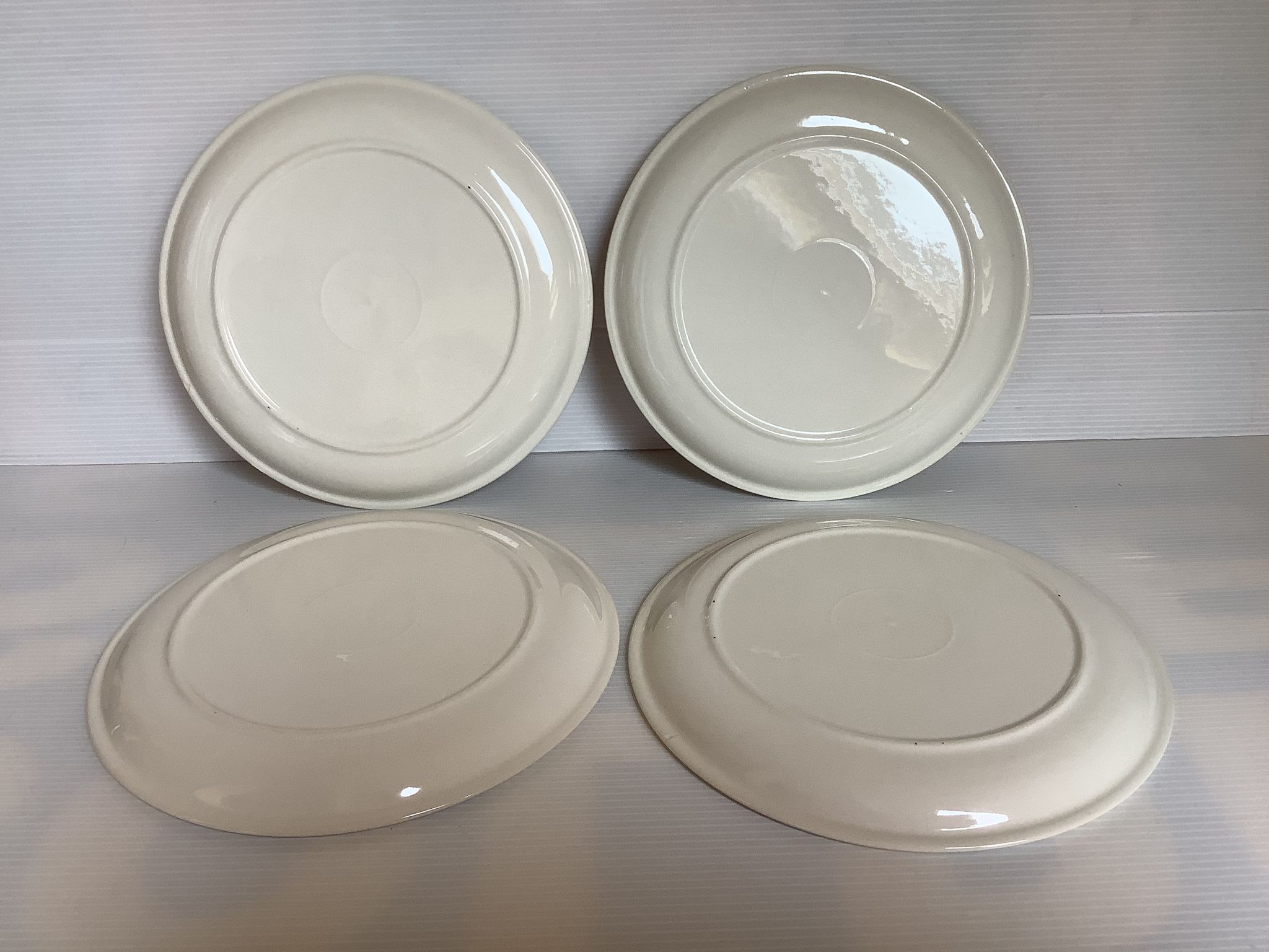 Four vintage floral cheese plates.
