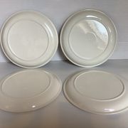 Four vintage floral cheese plates.