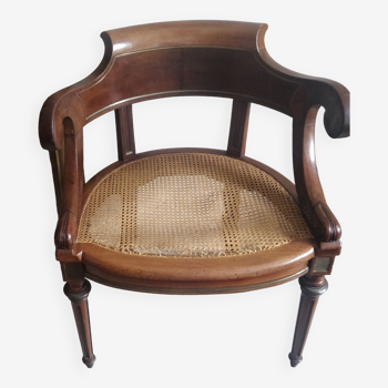 Fauteuil avec cannage et détail bronze