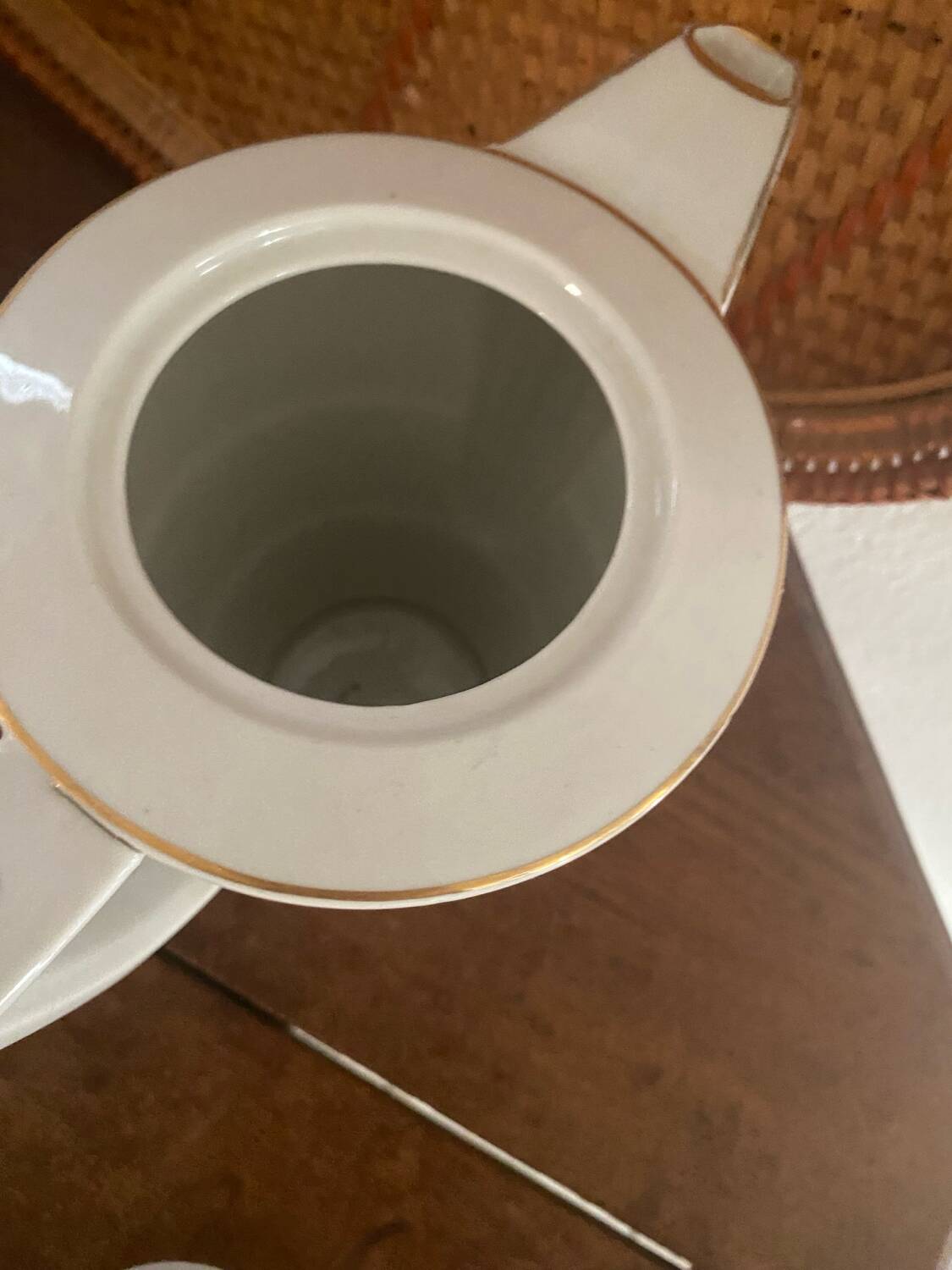 White and gold porcelain coffee pot in art deco style.
