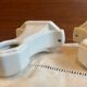Pair of white earthenware wall candlesticks