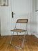 Vintage folding chair in metal and cane.