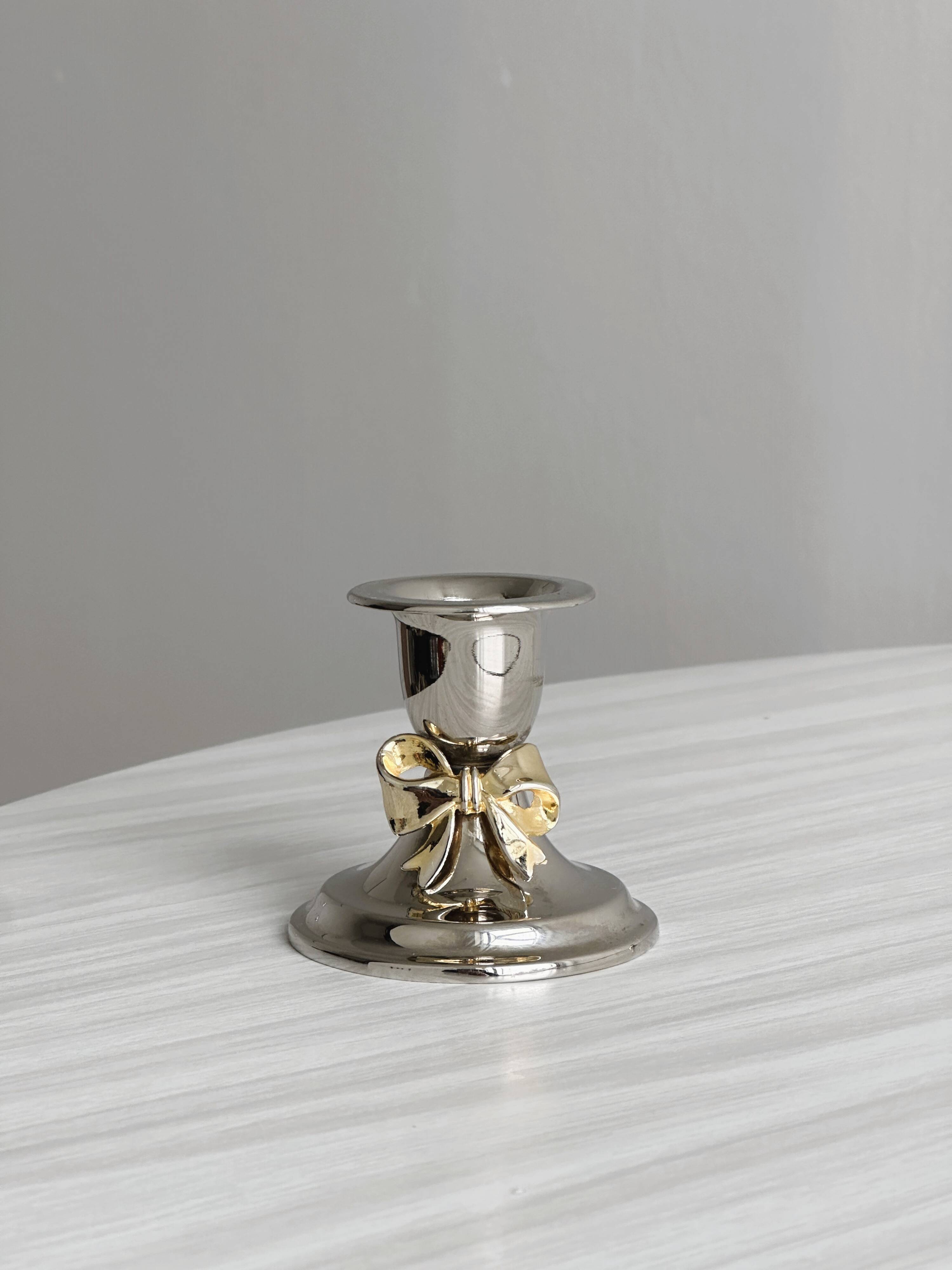 Pair of small antique metal candlesticks