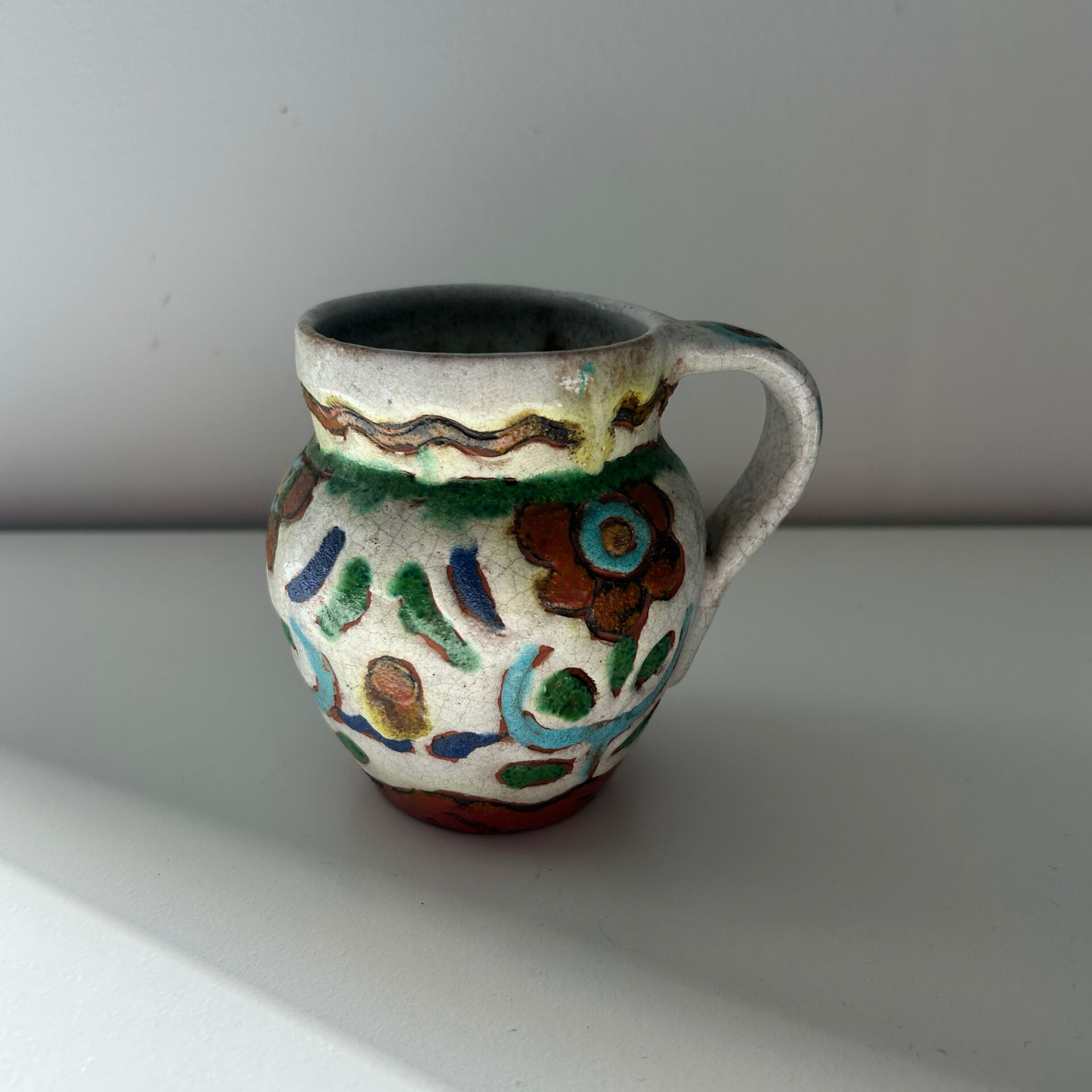 Small floral jug signed