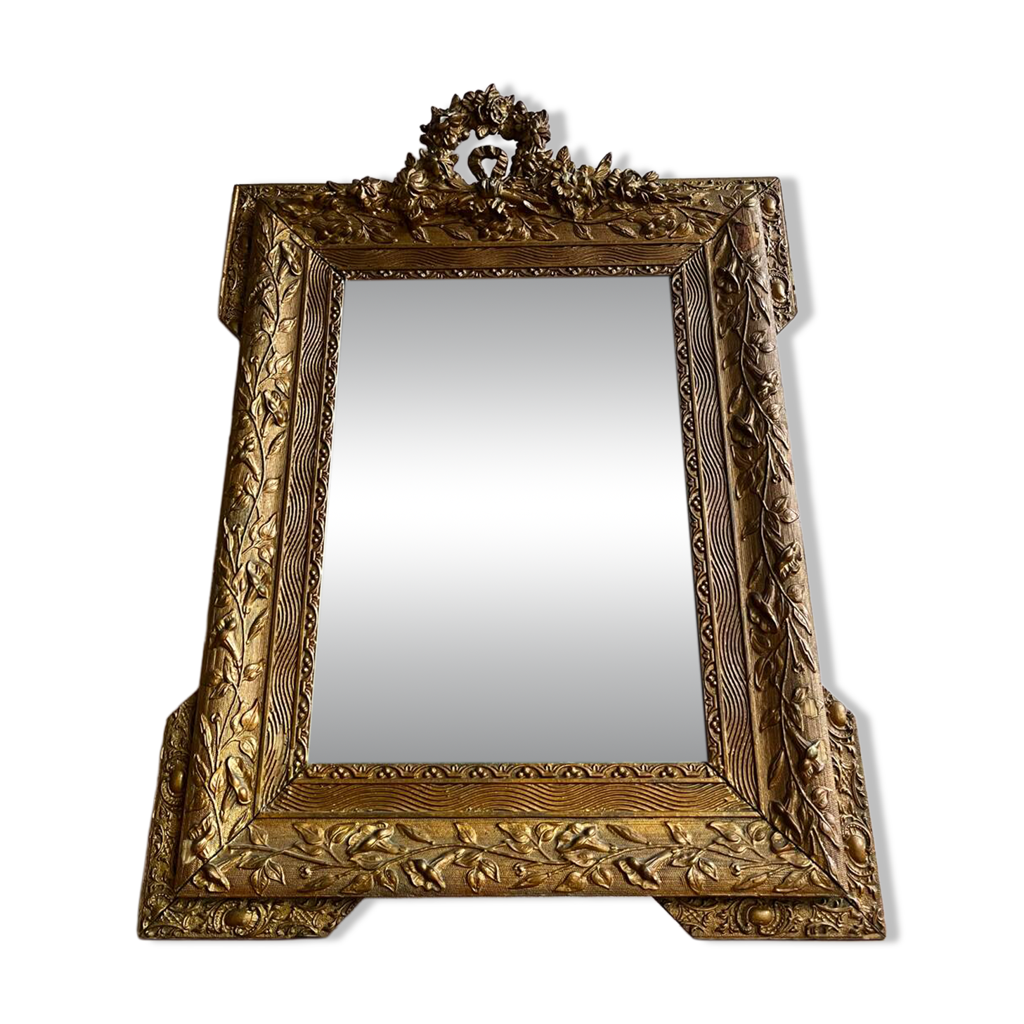 Golden trumeau mirror for fireplace, late 19th century, with sculpted pediment.