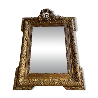 Golden trumeau mirror for fireplace, late 19th century, with sculpted pediment.