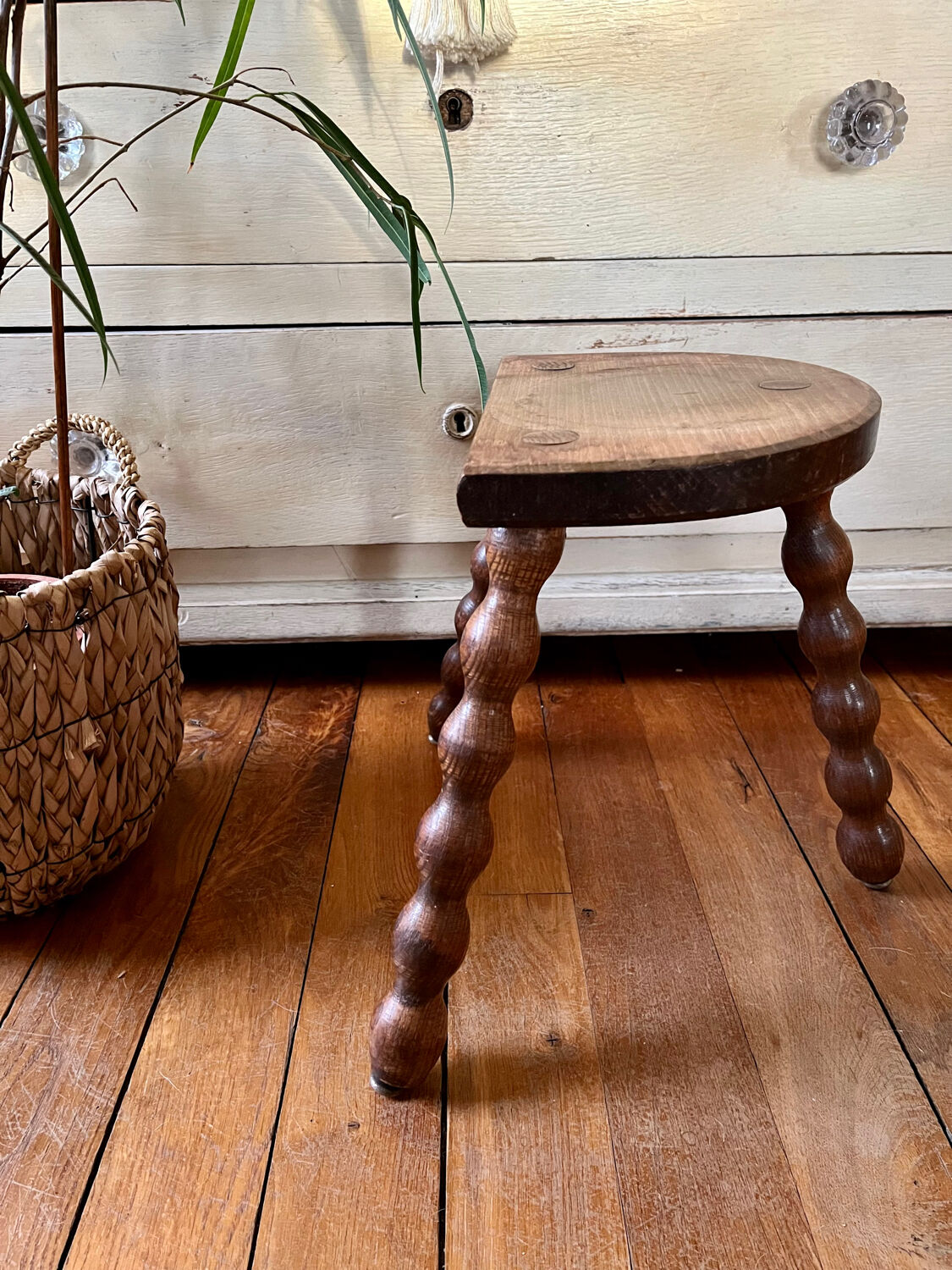 Low vintage wooden tripod stool