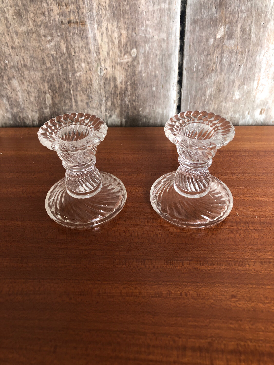 Old pair of vintage round molded glass candle holder