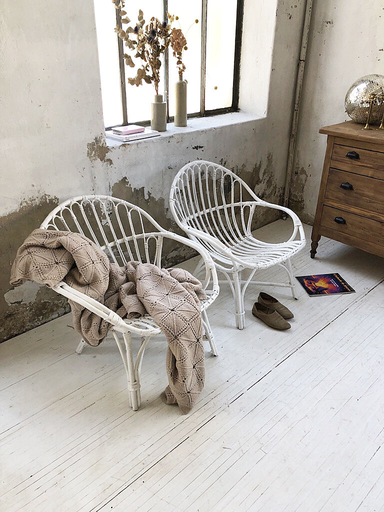 Pair of white rotin armchairs