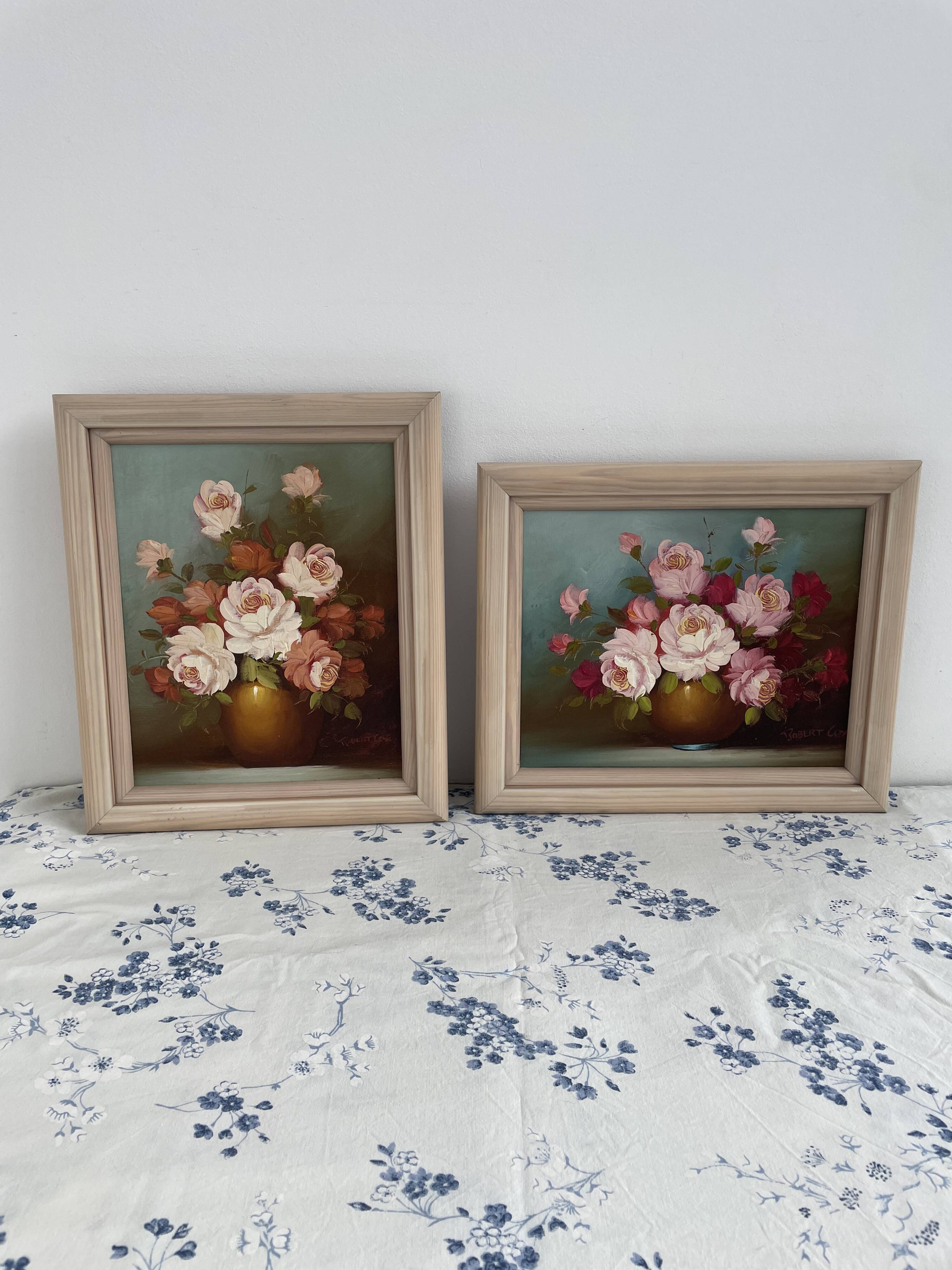 Pair of oils on canvas signed by Robert Cox, floral still lifes.