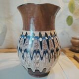 Pitcher with ethnic decorations