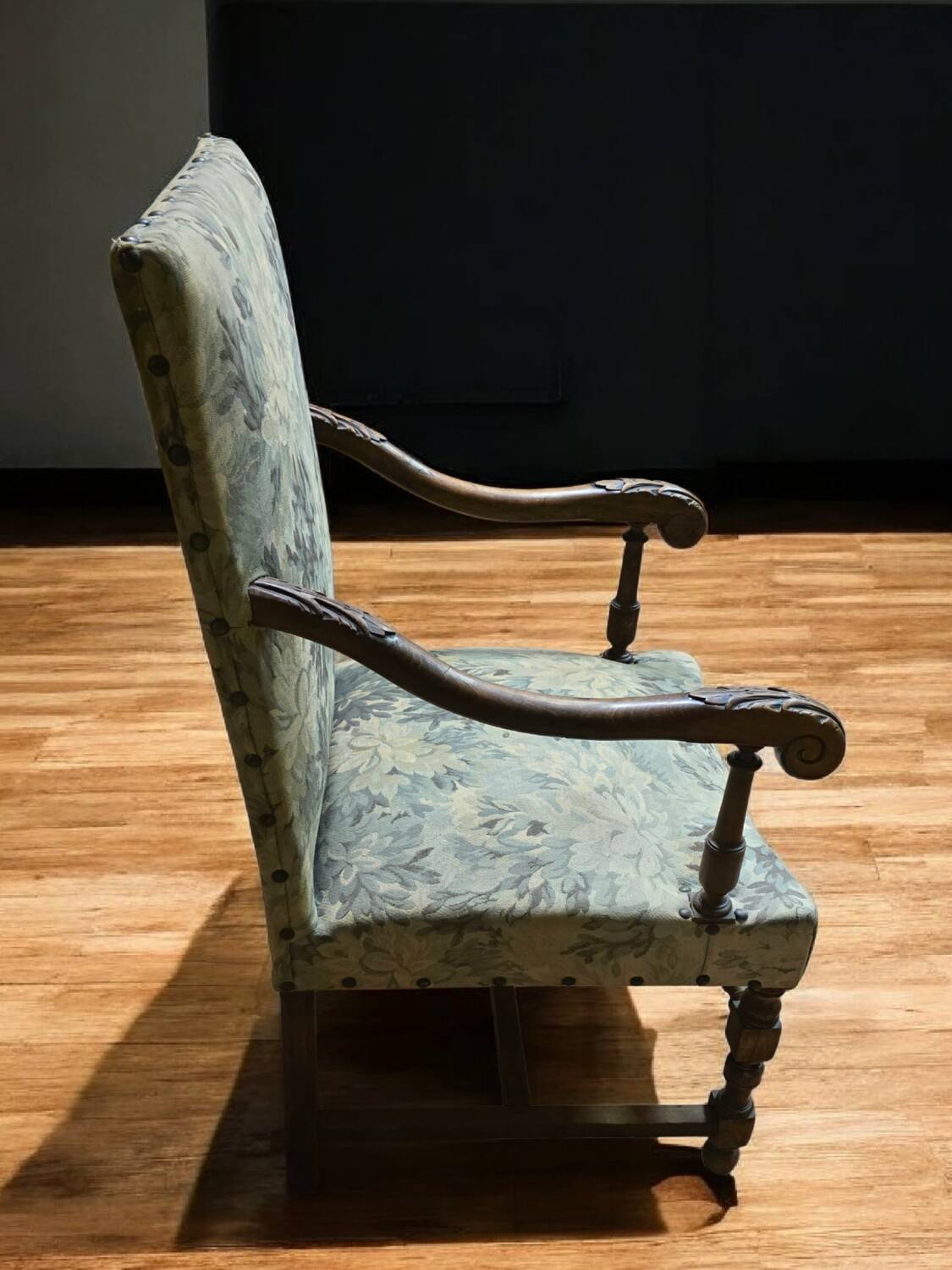 Empire armchair in carved wood and floral fabric