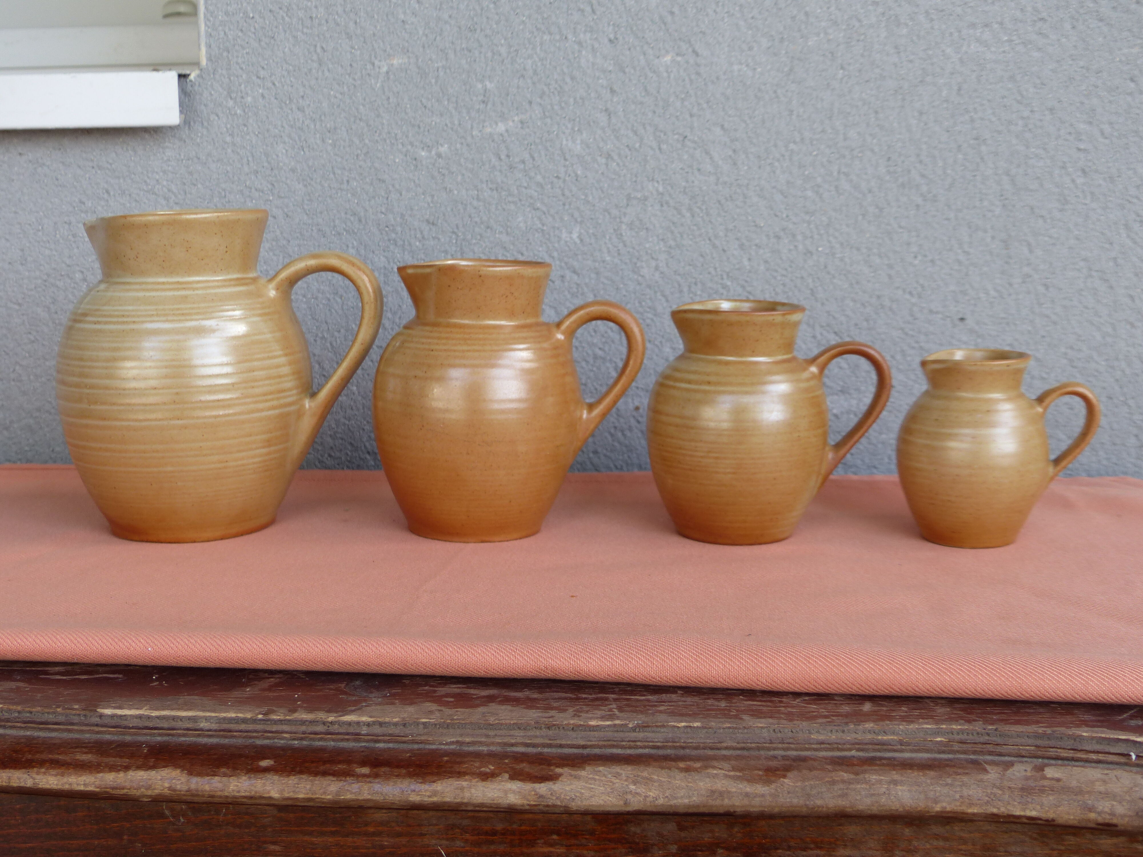 Set of 4 pitchers, CNP, Grès Village France.