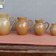 Set of 4 pitchers, CNP, Grès Village France.