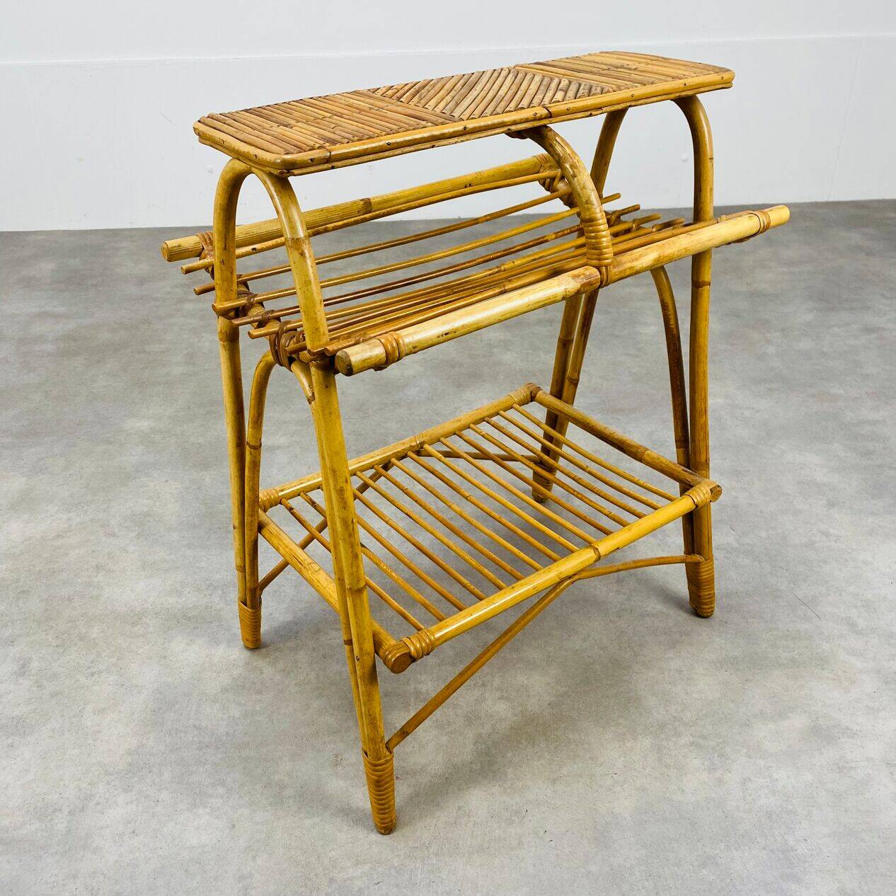 1960s rattan and bamboo coffee table, with its magazine rack.