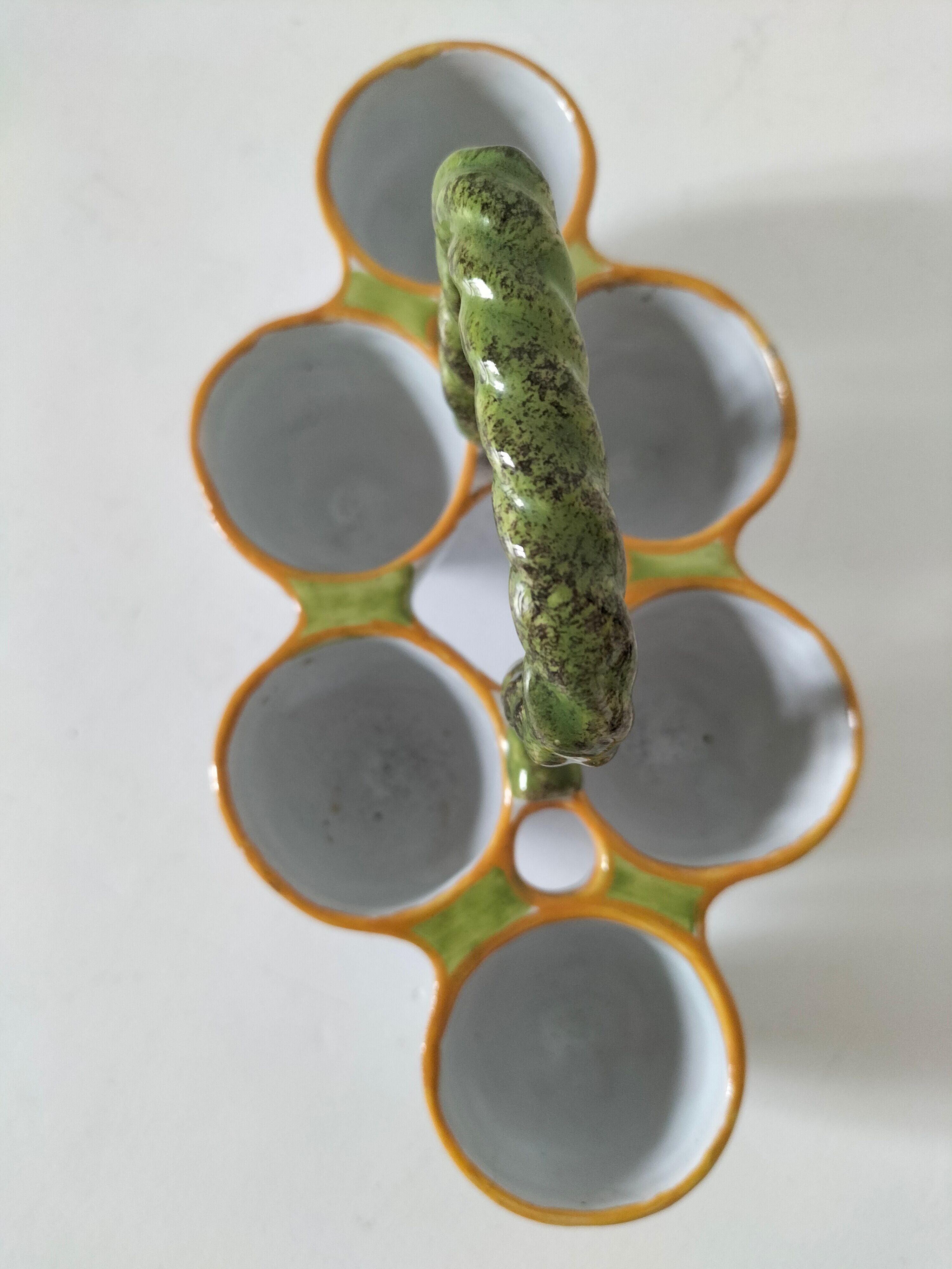 Antique egg holder by Jules Verlingue with polychrome floral decoration.