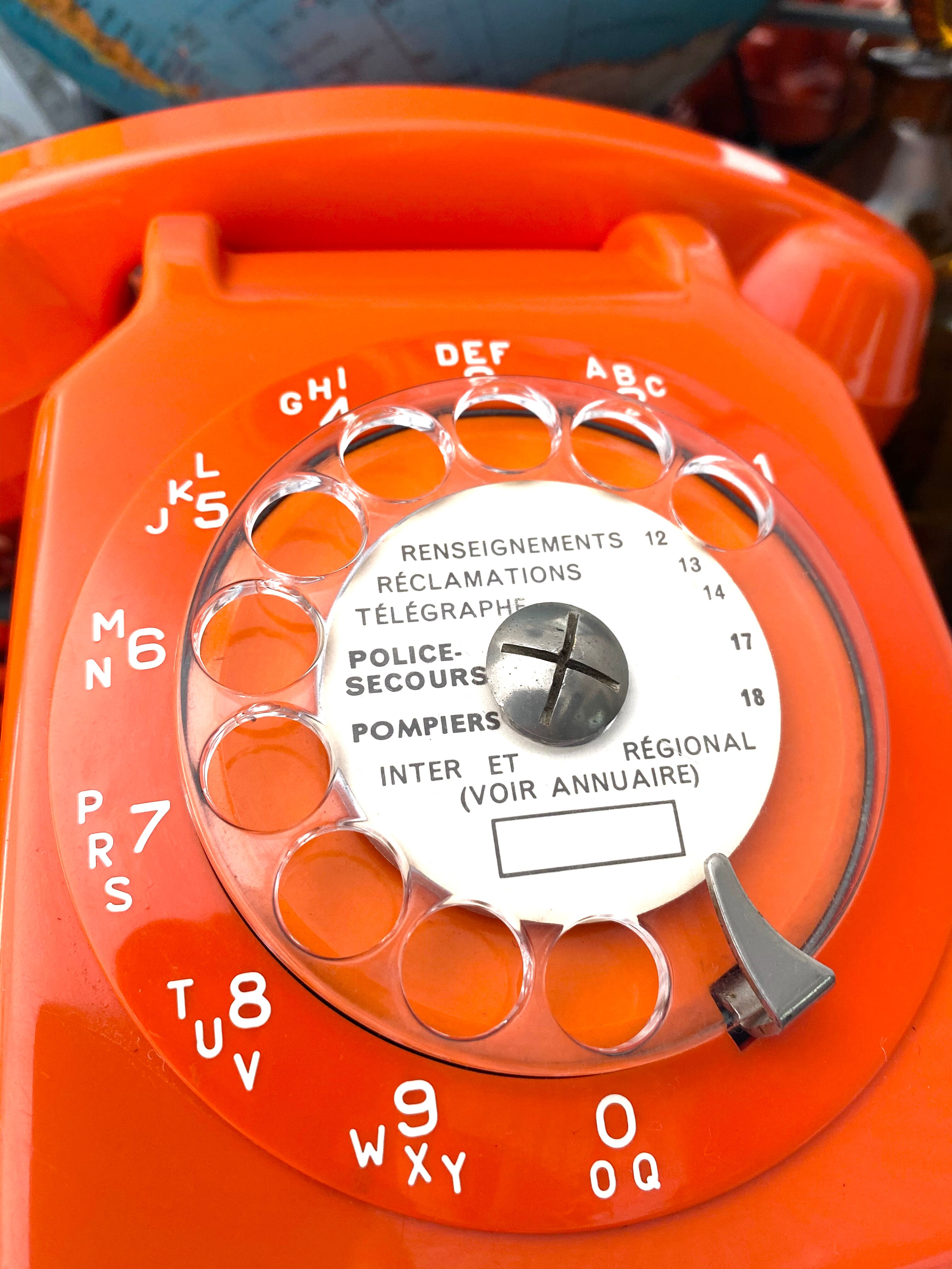 Orange vintage dial phone