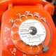 Orange vintage dial phone