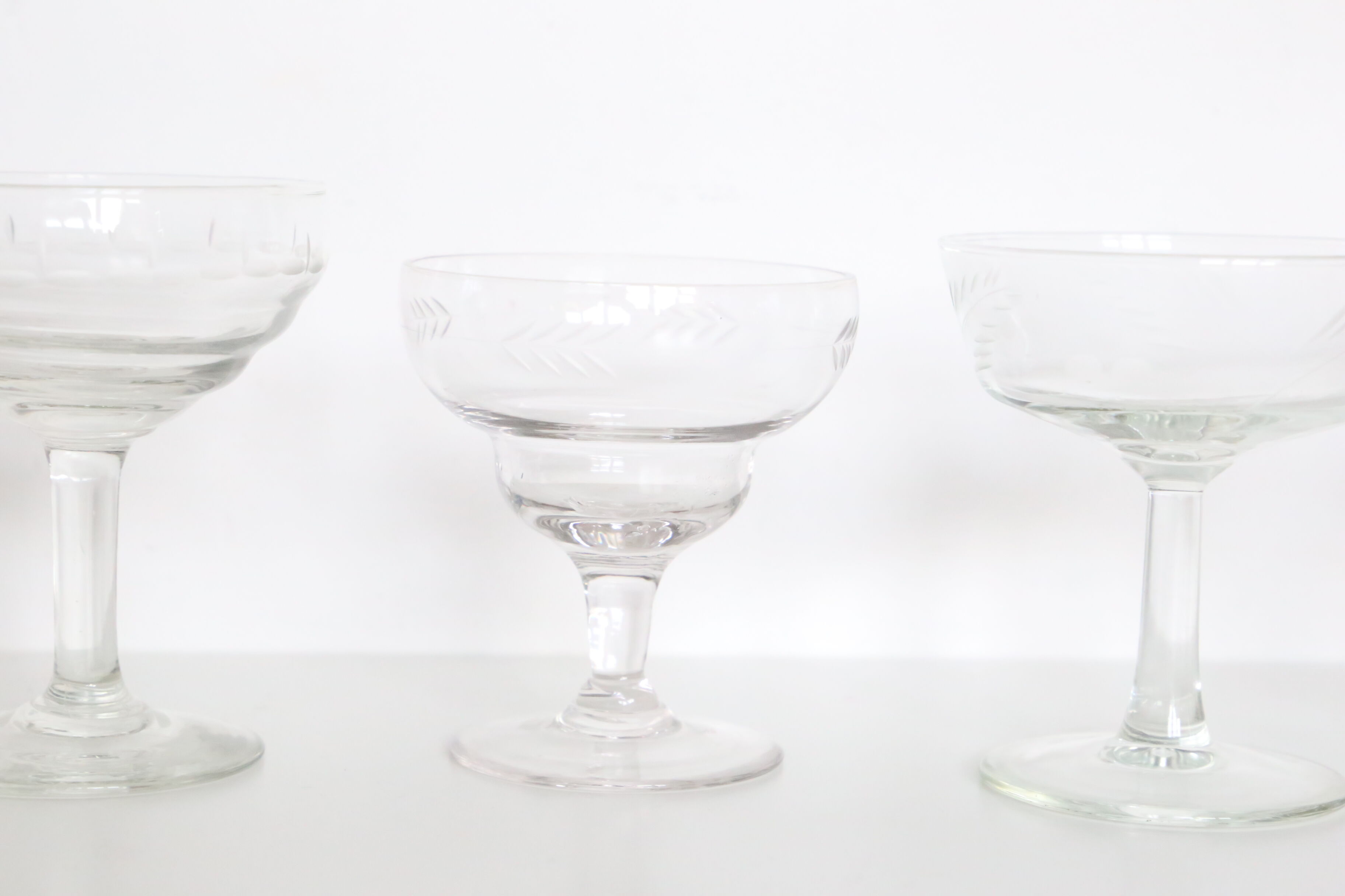 Set of 6 mismatched champagne glasses, chiseled glass