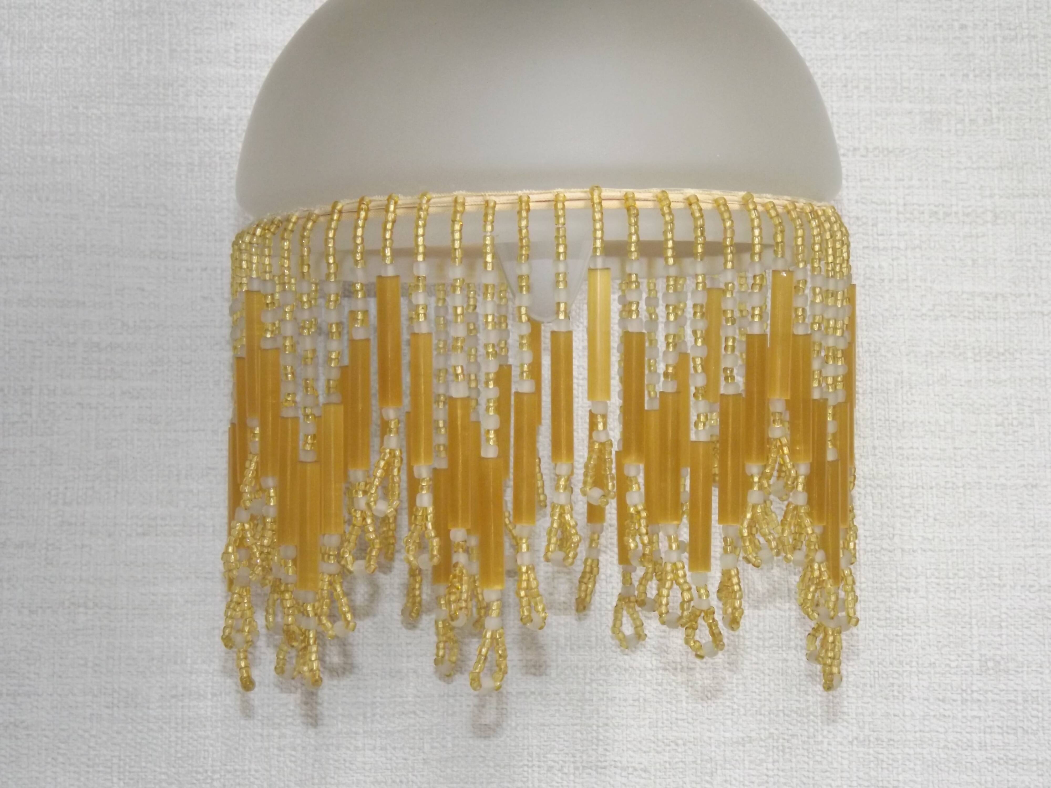 French vintage bronze effect single wall light with opaque beaded glass shade.