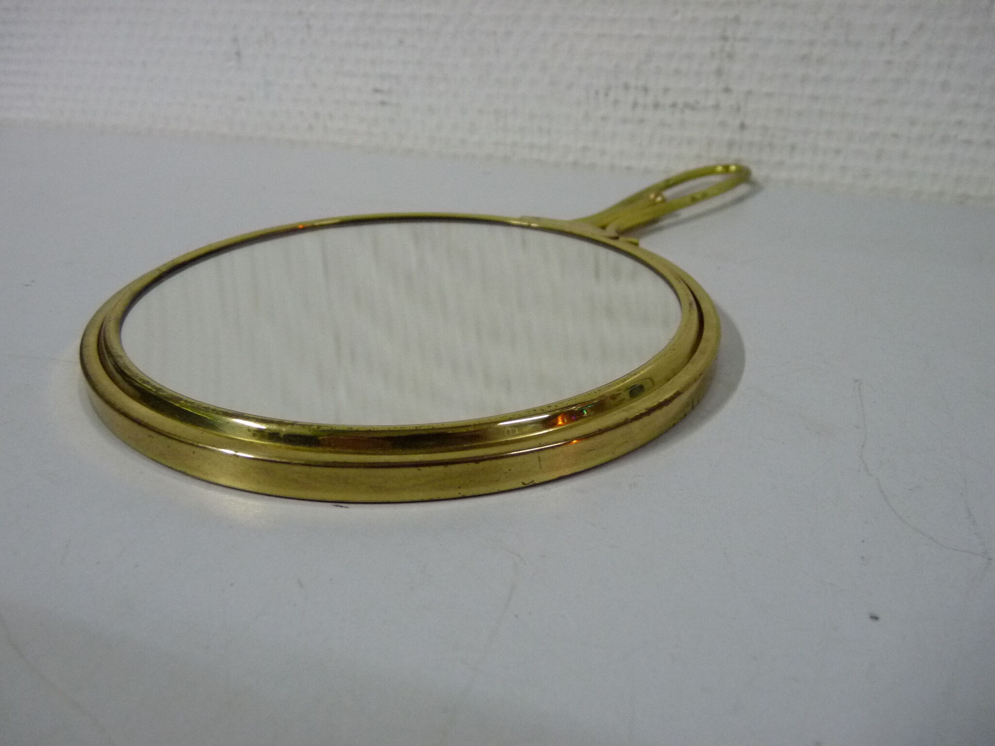 Old mirror double face with golden hand