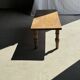 Brown Indonesian teak coffee table, with a border and cylindrical legs H40 L103.