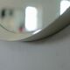 Circular mirror in "cream" laqué wood France circa 1960 68cm