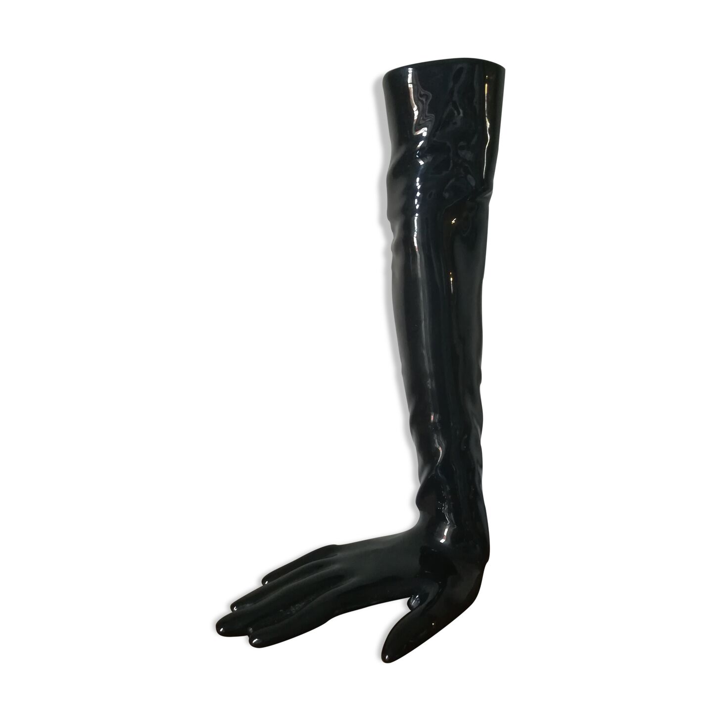Black earthenware vase gloved hand