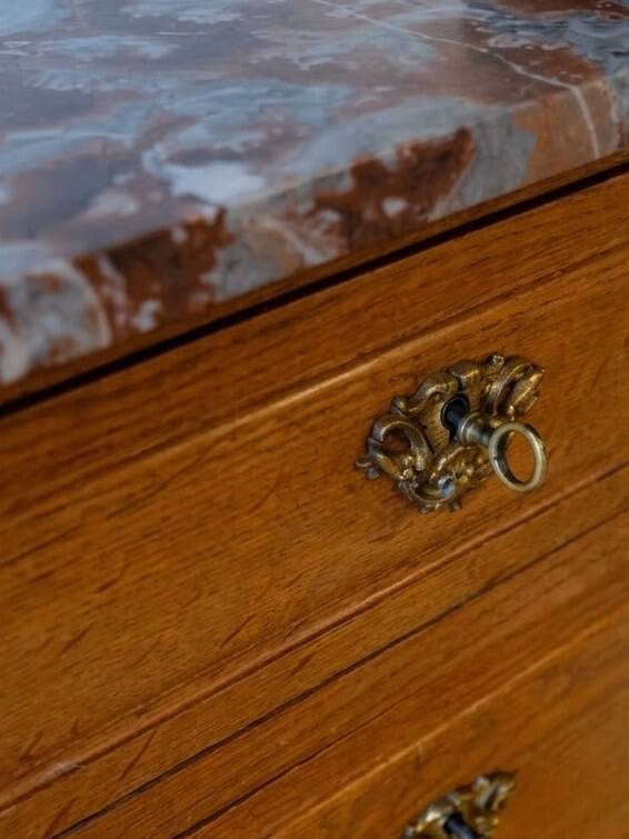 Antique wooden commode with marble and brass.