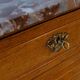 Antique wooden commode with marble and brass.