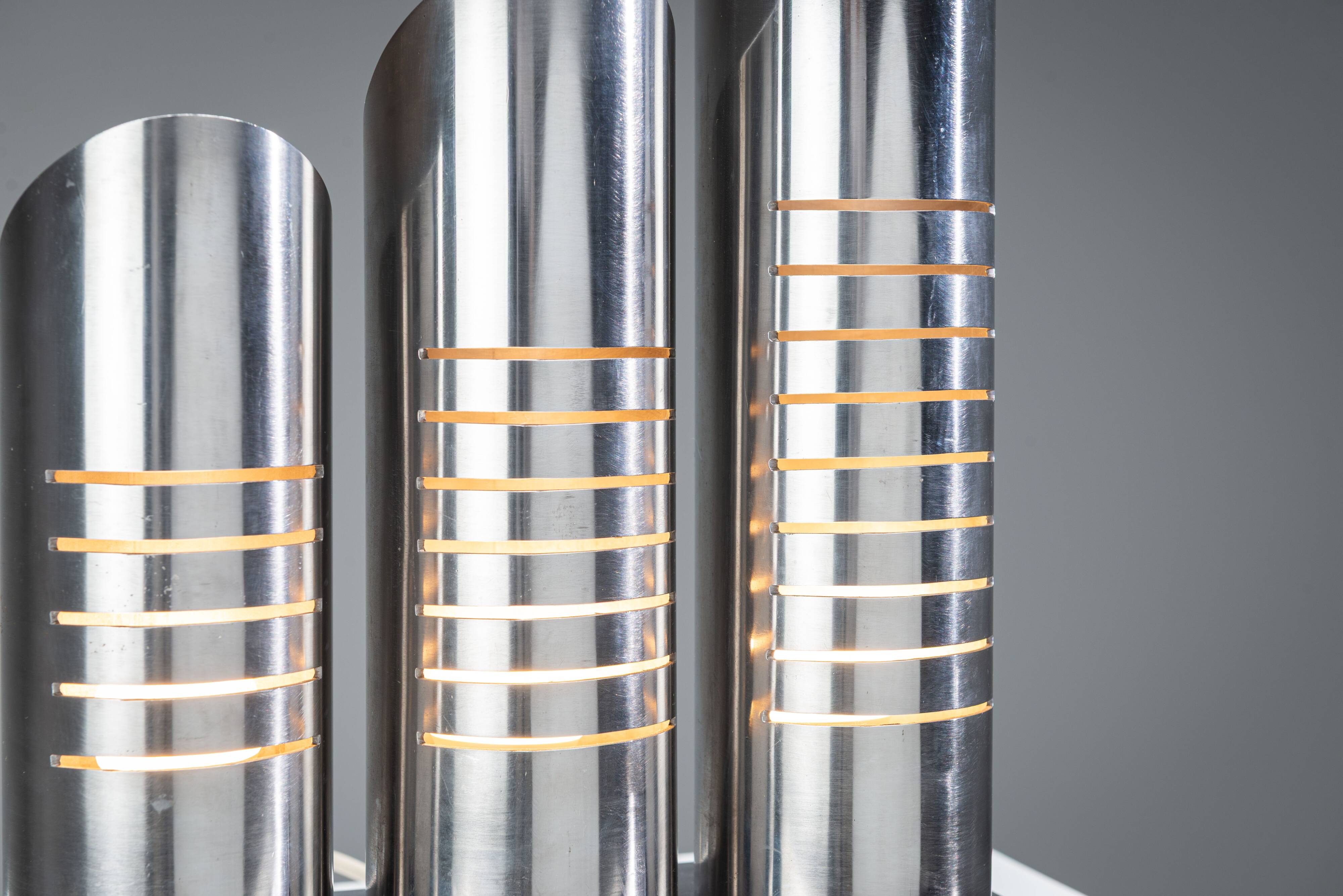 Triple column table lamp in stainless steel by Goffredo Reggiani