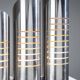 Triple column table lamp in stainless steel by Goffredo Reggiani