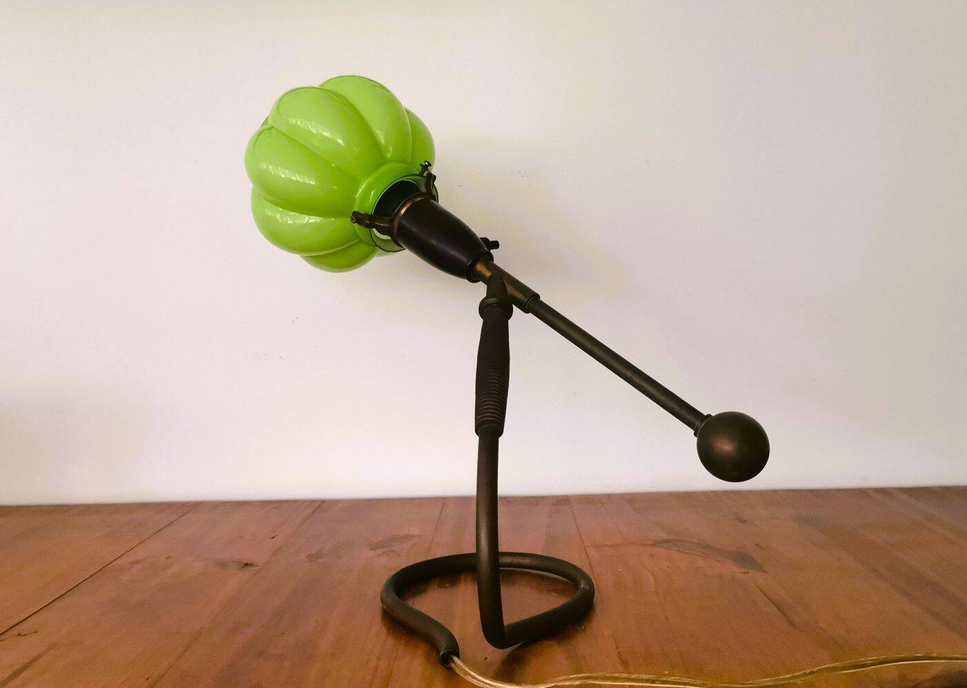 Modernist green cased glass and brass articulated table lamp