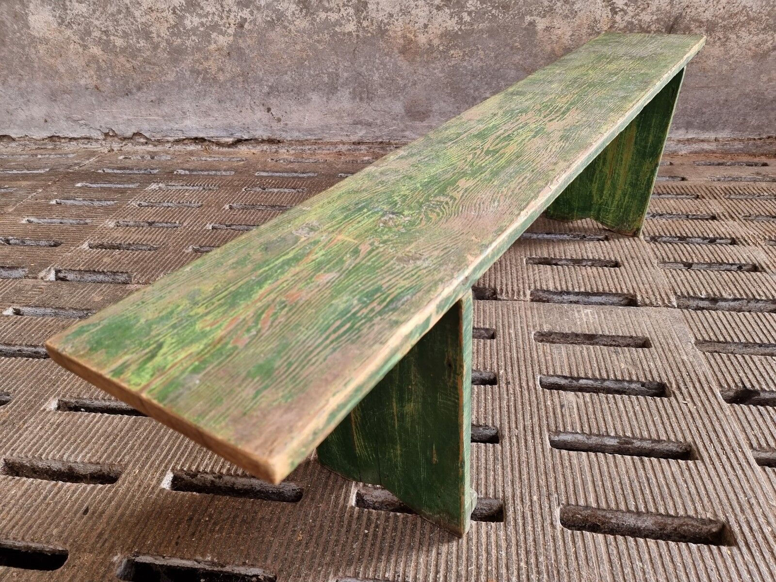 Old wooden bench side table grass green