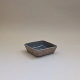 Stoneware pocket emptier