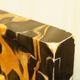 Pair of Portor marble bookends, black and golden yellow