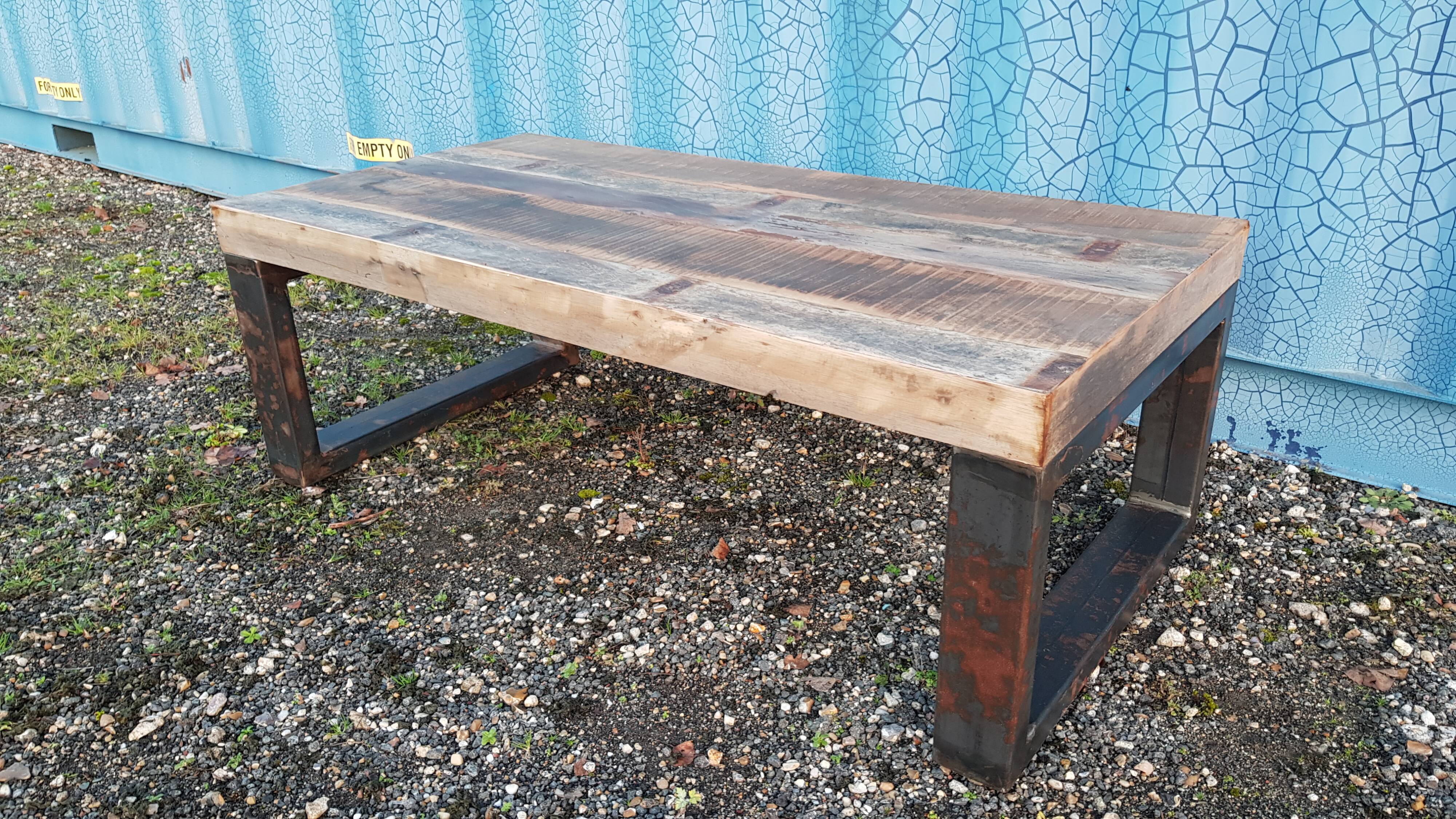 Industrial coffee table with wooden top and metal legs