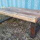 Industrial coffee table with wooden top and metal legs